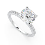 Load image into Gallery viewer, a white gold engagement ring with a round cut diamond