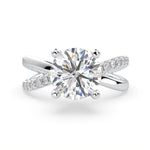 Load image into Gallery viewer, a diamond engagement ring with a twist band
