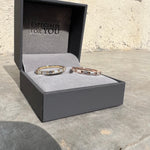 Load image into Gallery viewer, Pair of east-west baguette lab grown diamond half eternity rings displayed in a jewelry box