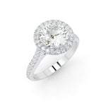 Load image into Gallery viewer, a diamond engagement ring with a halo setting