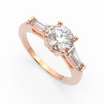 Load image into Gallery viewer, a rose gold engagement ring with three baguets