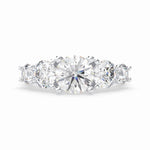 Load image into Gallery viewer, a three stone engagement ring with three diamonds