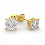 Load image into Gallery viewer, Natural round diamond stud earrings in 14K yellow gold with a classic four-prong solitaire setting.
