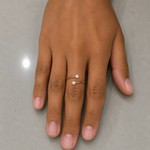Load image into Gallery viewer, Open rose gold ring with two round lab-grown diamonds shown on a woman’s hand
