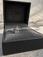 Load image into Gallery viewer, Close-up of a fifty fifty pear shape natural diamond ring displayed inside an open ring box.