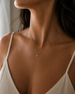 Load image into Gallery viewer, Lab-grown diamond cross necklace styled on a woman for an everyday luxury look.