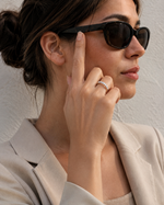 Load image into Gallery viewer, Seven round lab-grown diamond half eternity band shown on a woman wearing sunglasses.