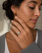 Load image into Gallery viewer, Woman wearing a cushion halo lab-grown diamond engagement ring in white gold.