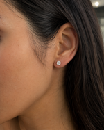 Load image into Gallery viewer, Round lab-grown diamond stud earring worn on ear close-up lifestyle image