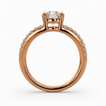Load image into Gallery viewer, Side profile of a split shank round natural diamond ring in rose gold showing the elevated setting.