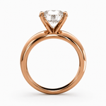 Load image into Gallery viewer, Round lab grown diamond solitaire ring in rose gold, side profile showing band and prong structure