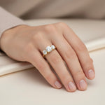 Load image into Gallery viewer, Three-stone round lab-grown diamond ring worn on hand, classic three-stone design in gold
