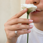 Load image into Gallery viewer, Elegant three-stone oval-cut diamond engagement ring worn on hand with natural diamonds