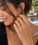 Load image into Gallery viewer, Natural Pear Halo Diamond Engagement Ring in White Gold Worn on Woman’s Hand