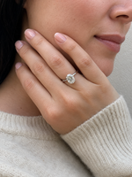 Load image into Gallery viewer, Oval solitaire lab-grown diamond engagement ring in white gold worn on a woman’s hand