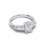 Load image into Gallery viewer, Emerald cut natural diamond ring with tapered sides in white gold ā angled side view