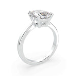 Load image into Gallery viewer, Emerald cut natural diamond solitaire engagement ring in white gold, angled perspective