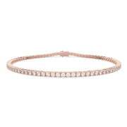 Classic round tennis bracelet with natural diamonds in rose gold, studio view