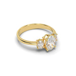 Load image into Gallery viewer, Side view of three-stone oval-cut diamond engagement ring with natural diamonds