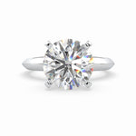 Load image into Gallery viewer, a round cut diamond ring on a white background