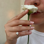 Load image into Gallery viewer, Elegant three-stone oval-cut diamond engagement ring worn on hand with natural diamonds
