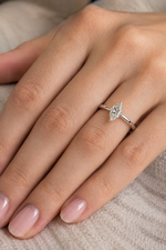 Load image into Gallery viewer, Marquise cut lab-grown diamond solitaire ring in white gold on a woman’s hand
