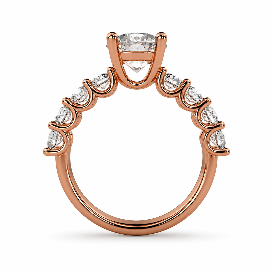 Ericiera round natural diamond ring in 18K rose gold with a round brilliant center diamond and diamond accent band, side view.