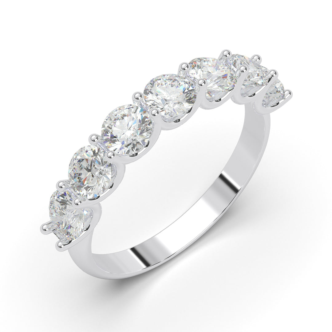 a white gold ring with five stones