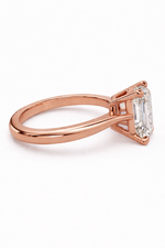 Load image into Gallery viewer, Rose gold emerald-cut solitaire natural diamond ring shown from the side.