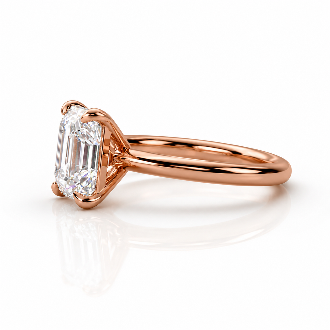Side view of an Asscher cut solitaire lab-grown diamond ring in rose gold, showing the raised four-prong setting and slim band.