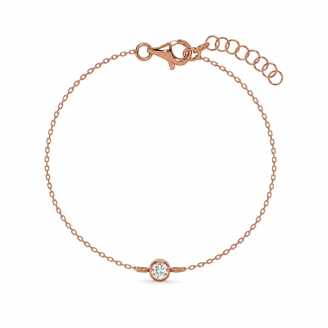     Round bezel natural diamond bracelet in rose gold on a white background.
