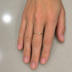 Load image into Gallery viewer, Woman wearing an open pear-cut lab-grown diamond ring on her finger