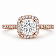     Cushion halo natural diamond ring in rose gold, front view on a white background.