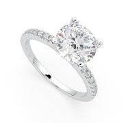 a white gold engagement ring with a round cut diamond