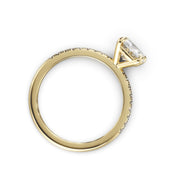 a yellow gold engagement ring with a diamond
