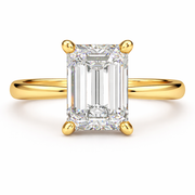 Emerald cut natural diamond solitaire engagement ring in yellow gold, front view