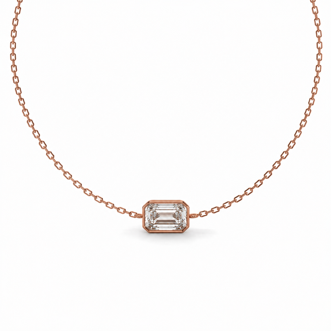     Close-up of an emerald-cut natural diamond bezel bracelet in rose gold.
