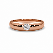 Front view of Statement Natural Diamond Solitaire Ring in rose gold featuring a round natural diamond on a polished gold band