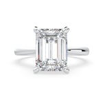 Load image into Gallery viewer, an emerald cut diamond ring on a white background
