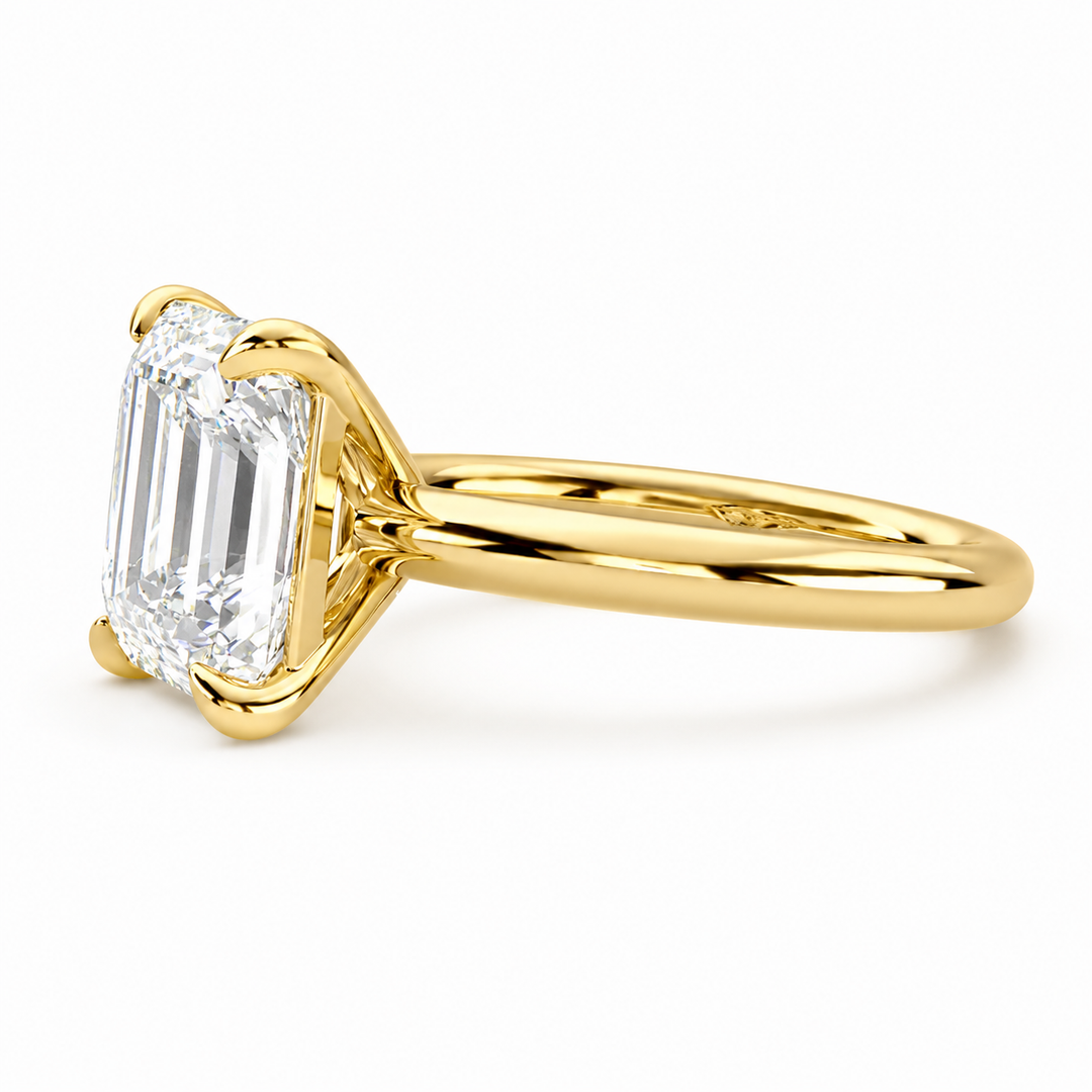 Side view of an Asscher cut solitaire natural diamond ring in yellow gold, highlighting the slim band and elevated setting.