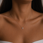 Load image into Gallery viewer, Woman wearing a marquise lab-grown diamond solitaire pendant necklace in 14K rose gold styled as an everyday minimalist necklace.