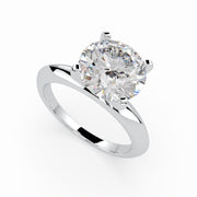 a white gold engagement ring with a round cut diamond