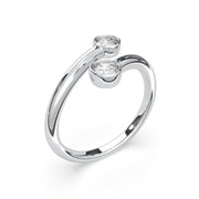 a white gold ring with two diamonds on it