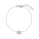 Load image into Gallery viewer,     Emerald-cut natural diamond bezel bracelet in white gold on a white background.