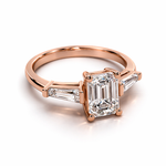Load image into Gallery viewer, Emerald cut natural diamond ring with tapered sides in rose gold – angled side view