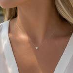 Load image into Gallery viewer, Lab-Grown Stormy Asymmetric Round Diamond Necklace in White Gold Worn by a Woman, Featuring a Delicate Asymmetric Diamond Pendant on a Fine Chain