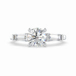 Load image into Gallery viewer, a diamond engagement ring with three baguetts
