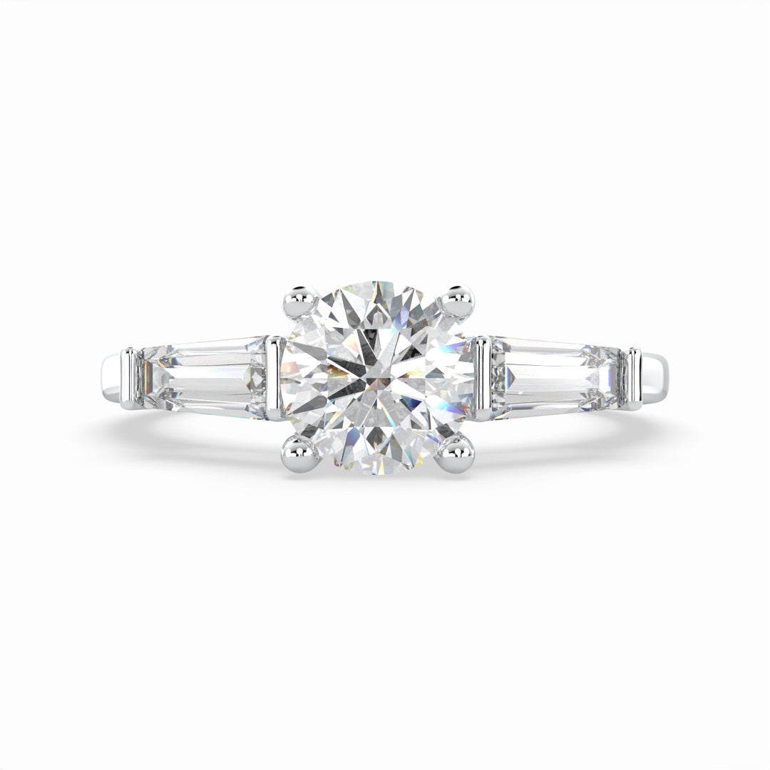 a diamond engagement ring with three baguetts