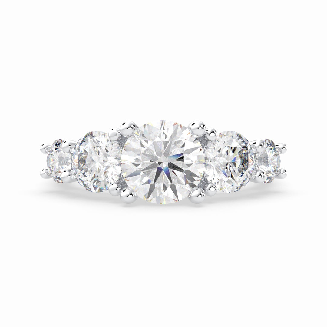 a three stone engagement ring with three diamonds