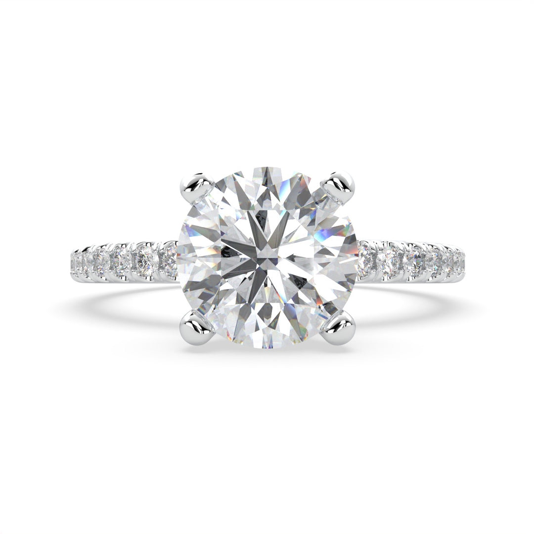 a diamond engagement ring with a side stones